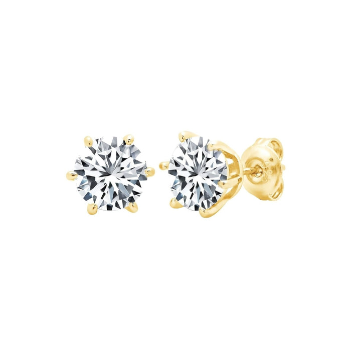 Gold stud earrings with clear gemstones on a white background