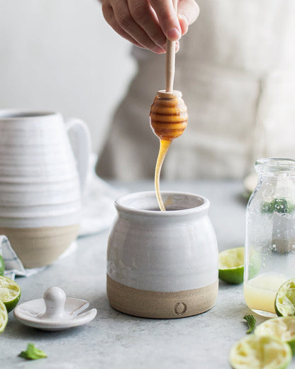Beehive Stoneware Honey Pot with Dipper — lifting the wooden dipper from the pot; Farmhouse Pottery