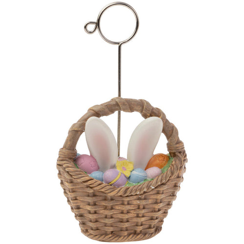 A resin placecard holder in the shape of a basket with a playful design featuring bunny ears and Easter eggs.