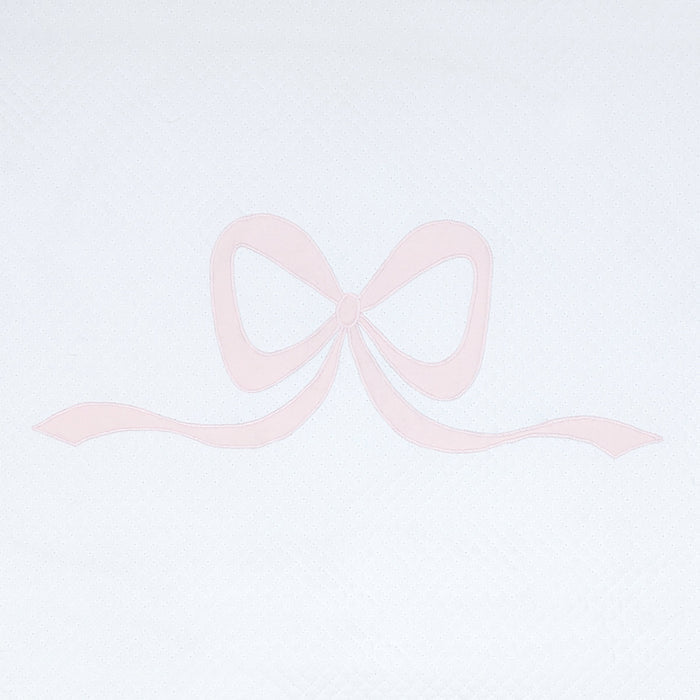 Close view of pink Lucy bow appliqué on white cotton by Lenora
