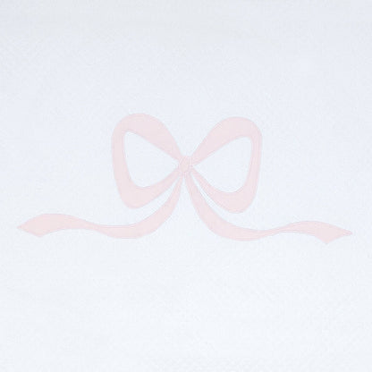 Close view of pink Lucy bow appliqué on white cotton by Lenora