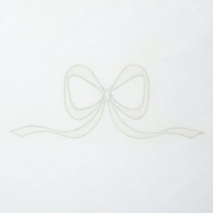 Close view of ivory Lucy bow appliqué on white cotton by Lenora