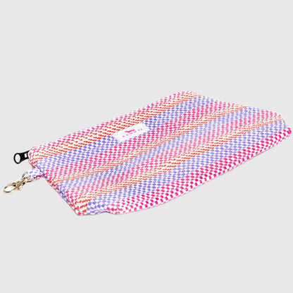 Multicolored fabric pouch with a zipper on a light gray background