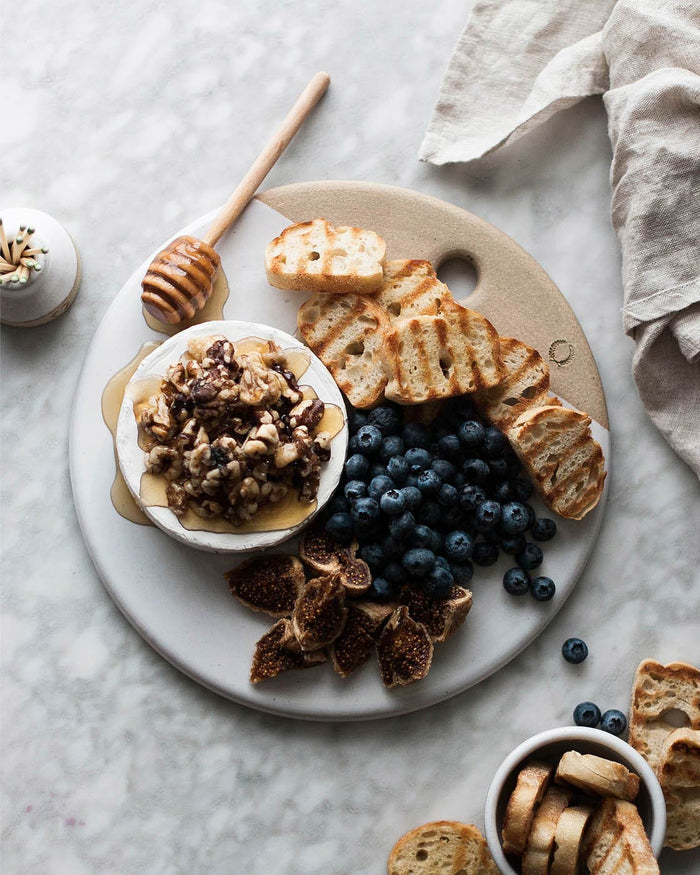 Round Stoneware Cheese Stone — cheese and accompaniments on a stone; Farmhouse Pottery