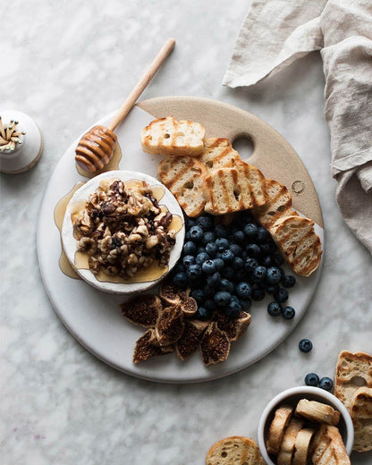 Round Stoneware Cheese Stone — cheese and accompaniments on a stone; Farmhouse Pottery