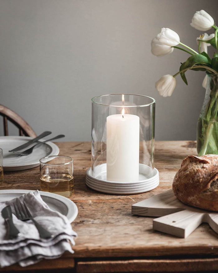 White Pillar Candle — pillar candle in a glass-shaded holder; Farmhouse Pottery