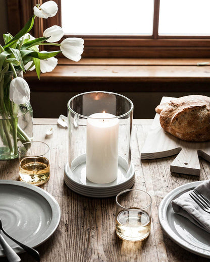 White Pillar Candle — pillar candle at a table with flowers; Farmhouse Pottery